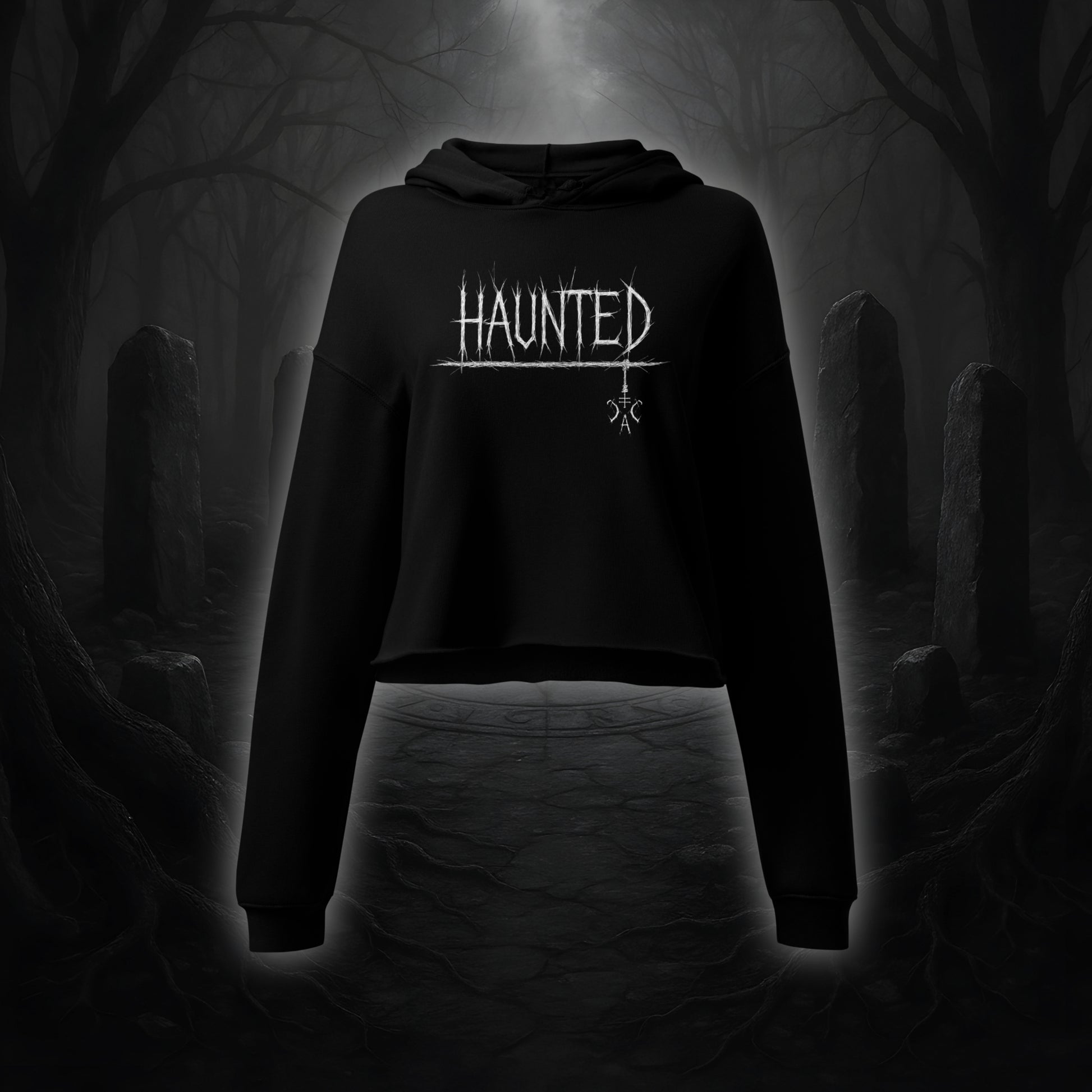 Schwarzer Crop Hoodie mit weißem Cultural Carnage Statement „HAUNTED“ im Attitude-Design